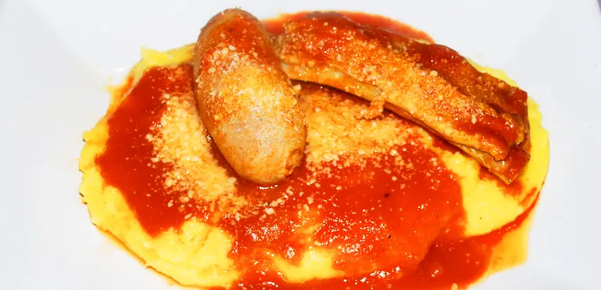 Polenta dressed with Tomato Sause and Sausages